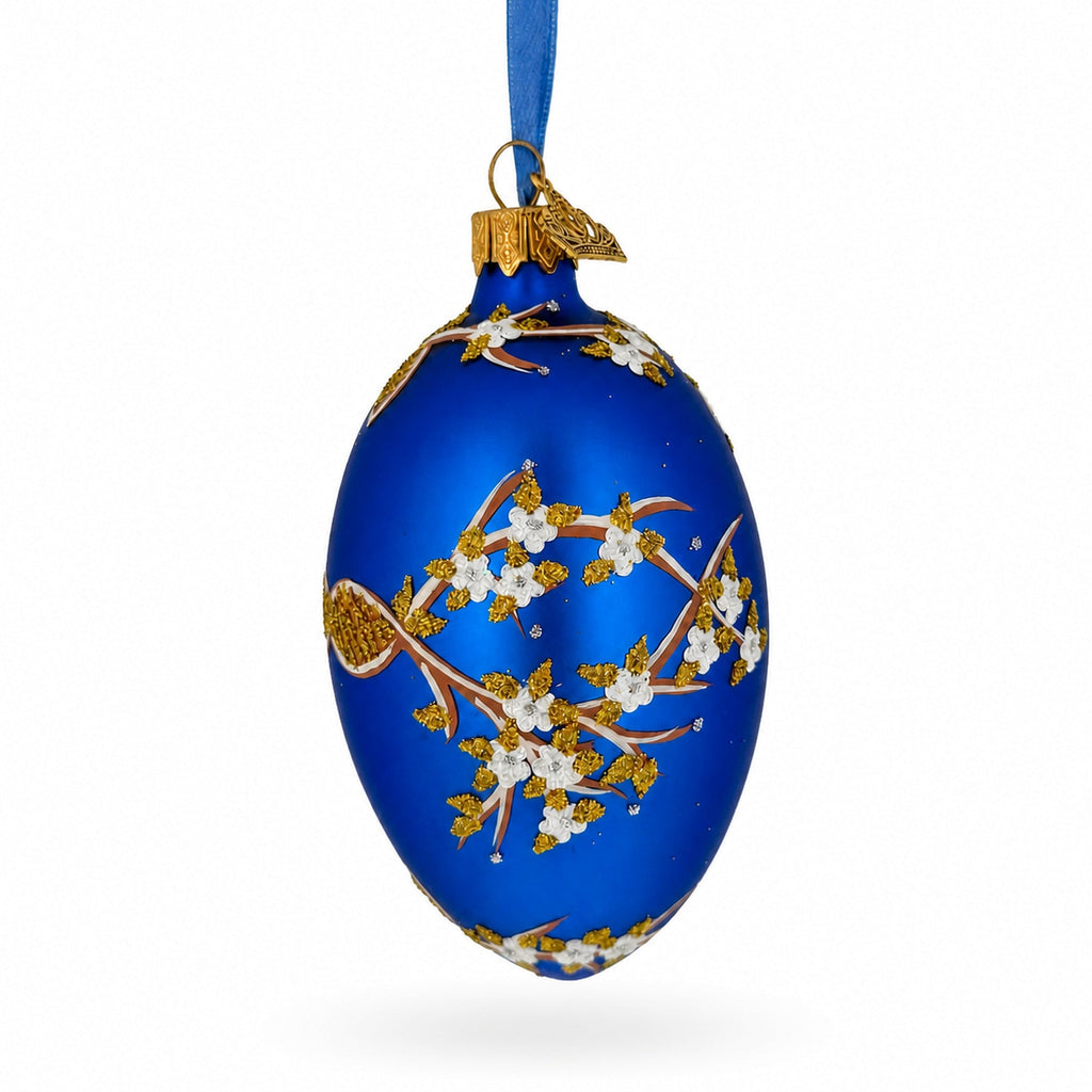 White Blossom Branch on Blue Glass Egg Ornament